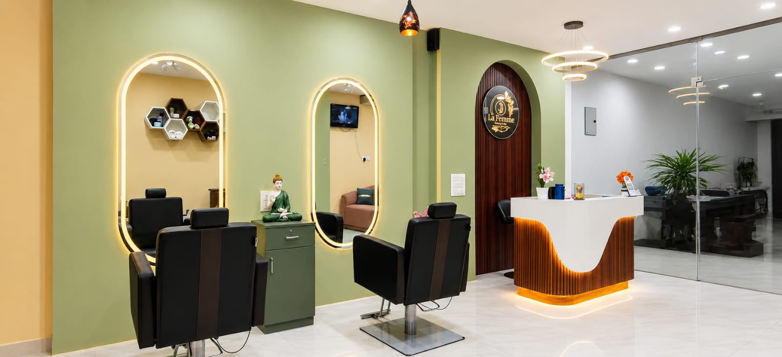 La Femme Glam Spot salon reception with arched mirrors and warm gold lighting